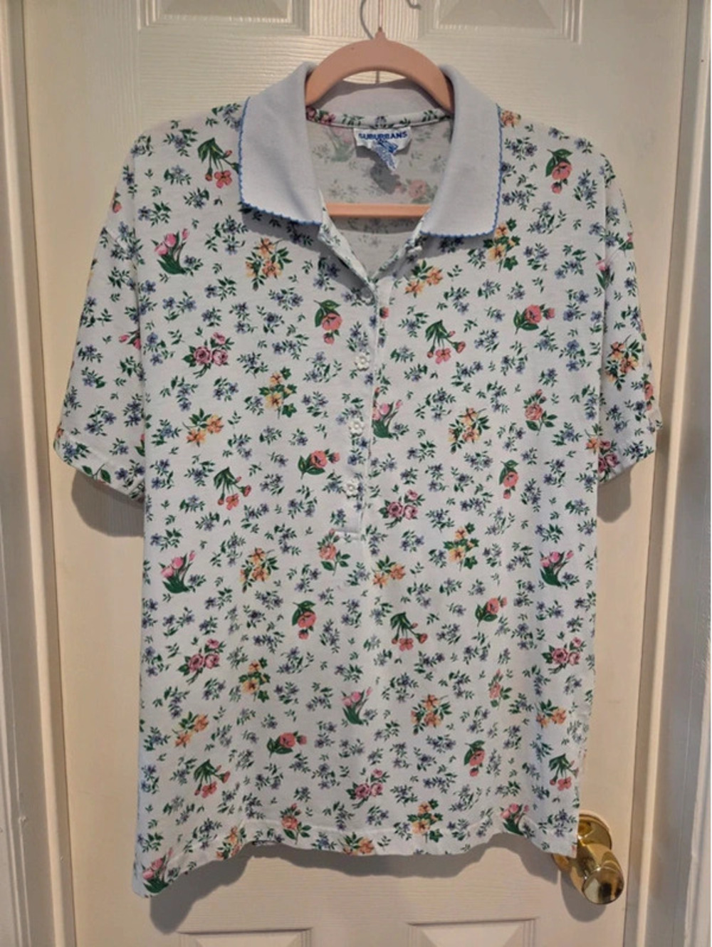 Vintage women's short-sleeve polo shirt by Country Suburbans